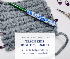 crochet swatch with stitch markers and hook