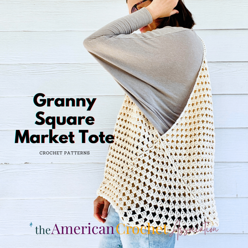 Woman wearing white Granny Square Market Tote Crochet Pattern - American Crochet Association