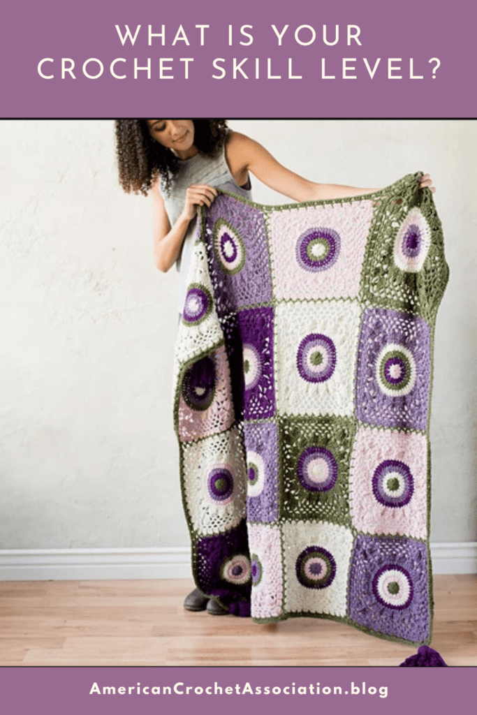woman holding crochet blanket