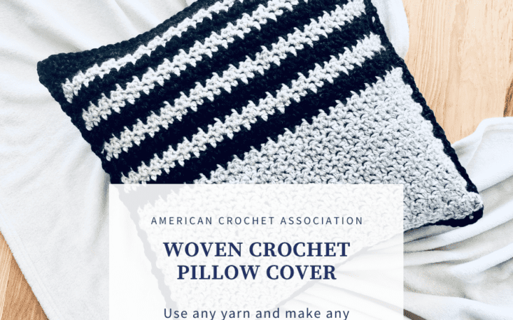 Crochet pillow on floor with blanket