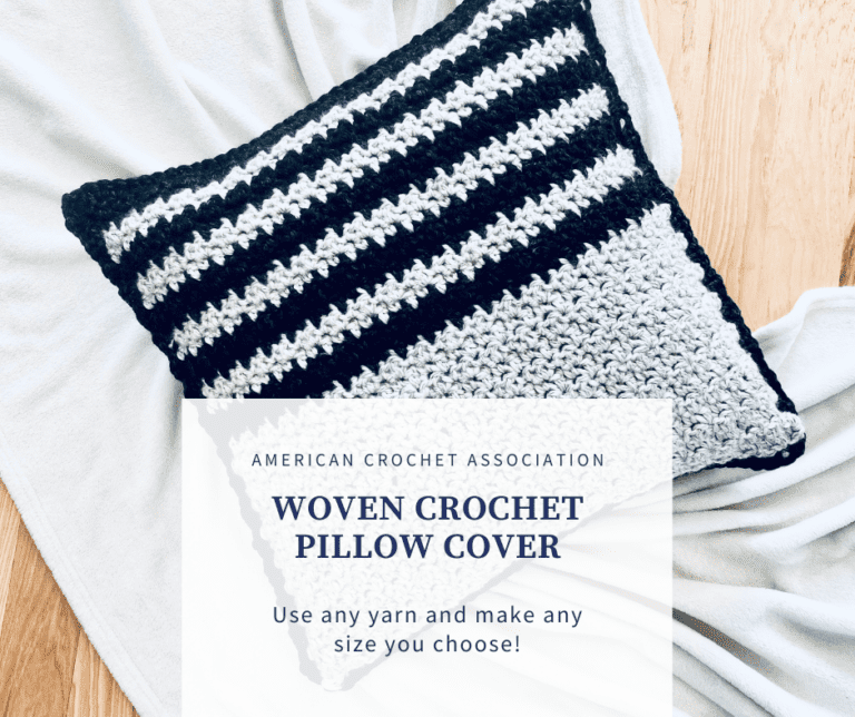 Crochet pillow on floor with blanket