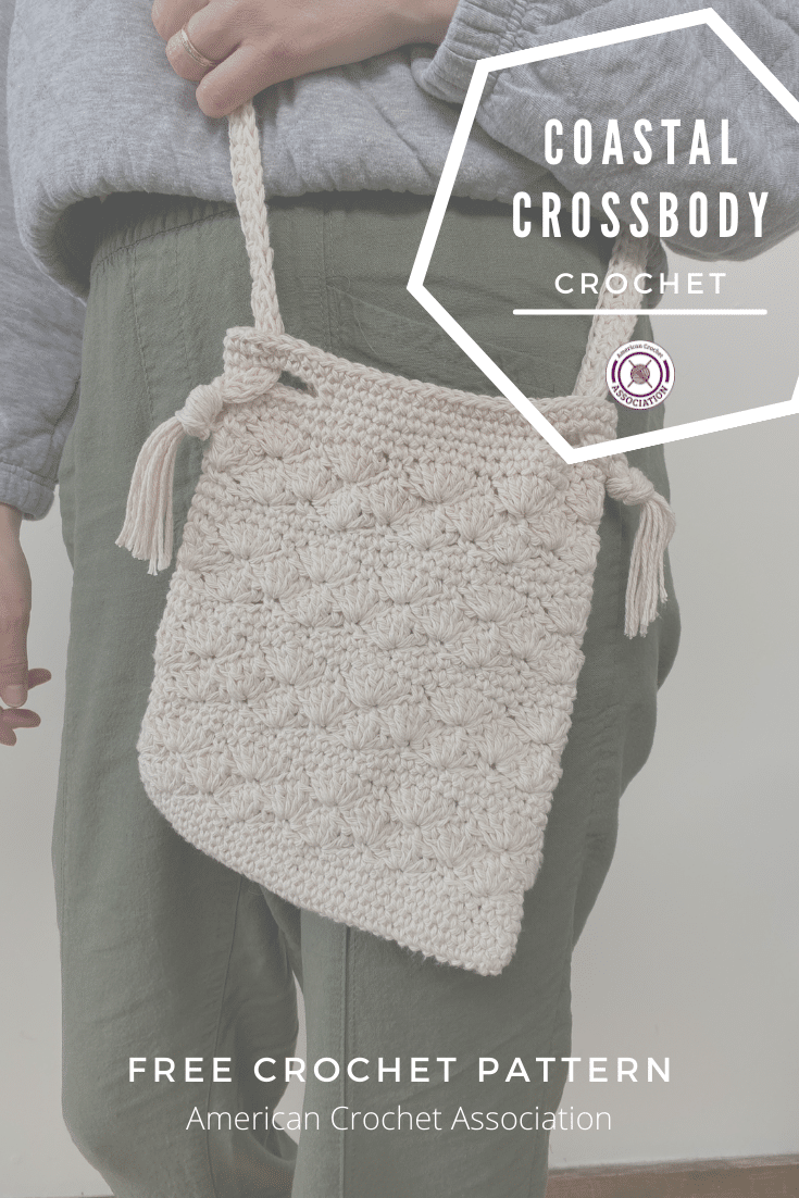 torso of person showing white crochet bag at hip
