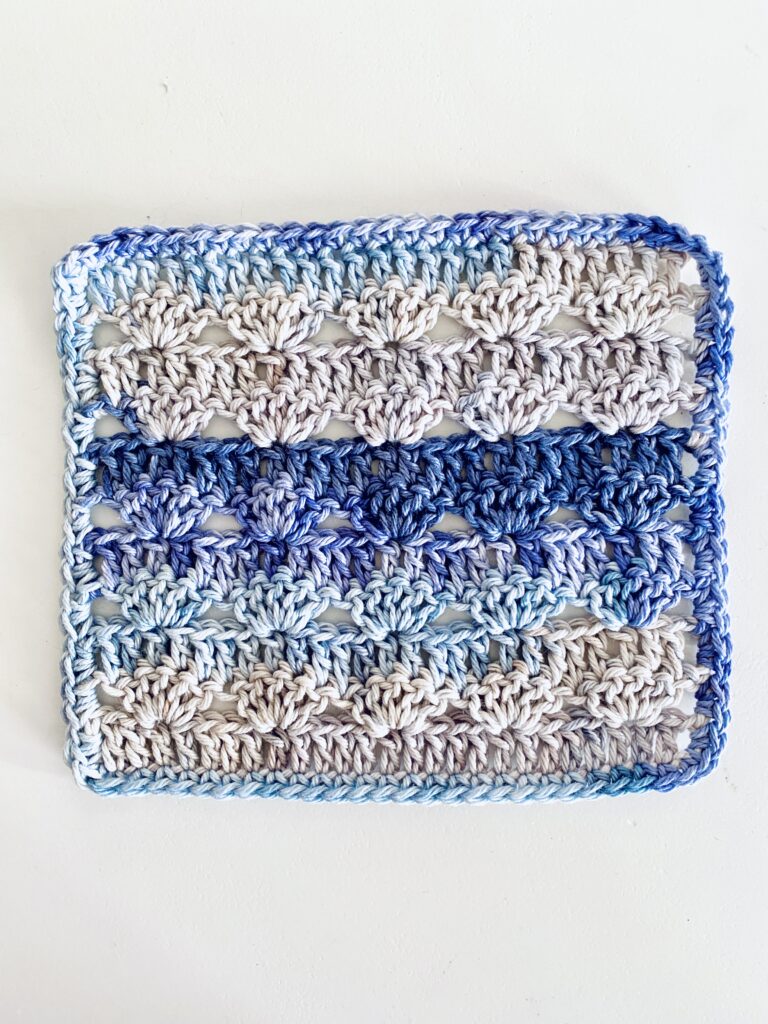 Wavy Shell Washcloth Crochet flat on surface