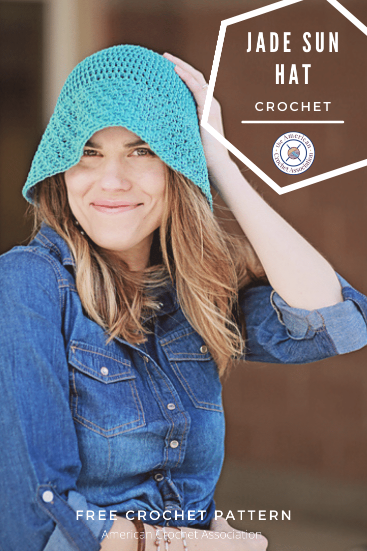 woman wearing blue crochet sun hat with floppy brim