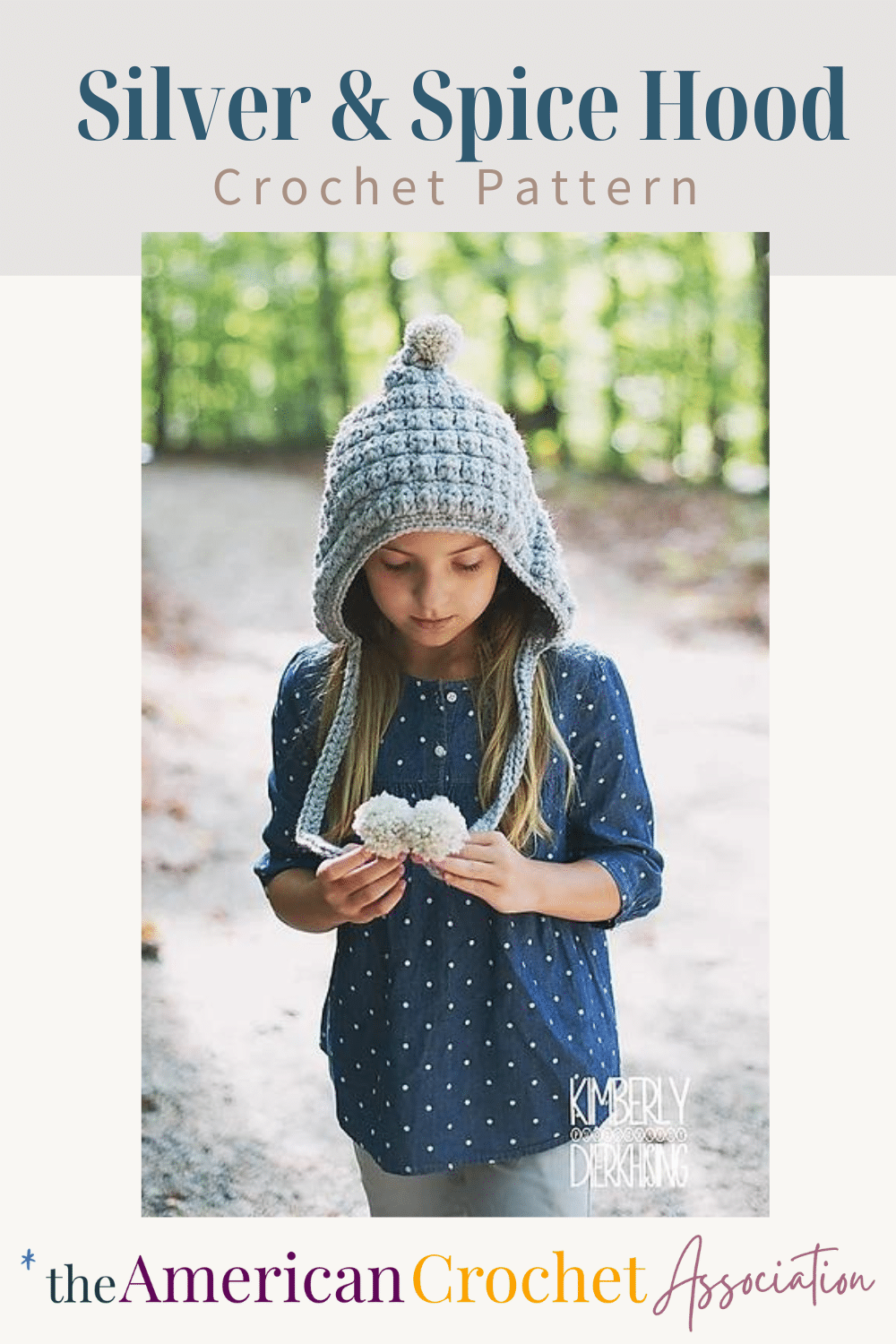 Girl wearing grey crochet hood