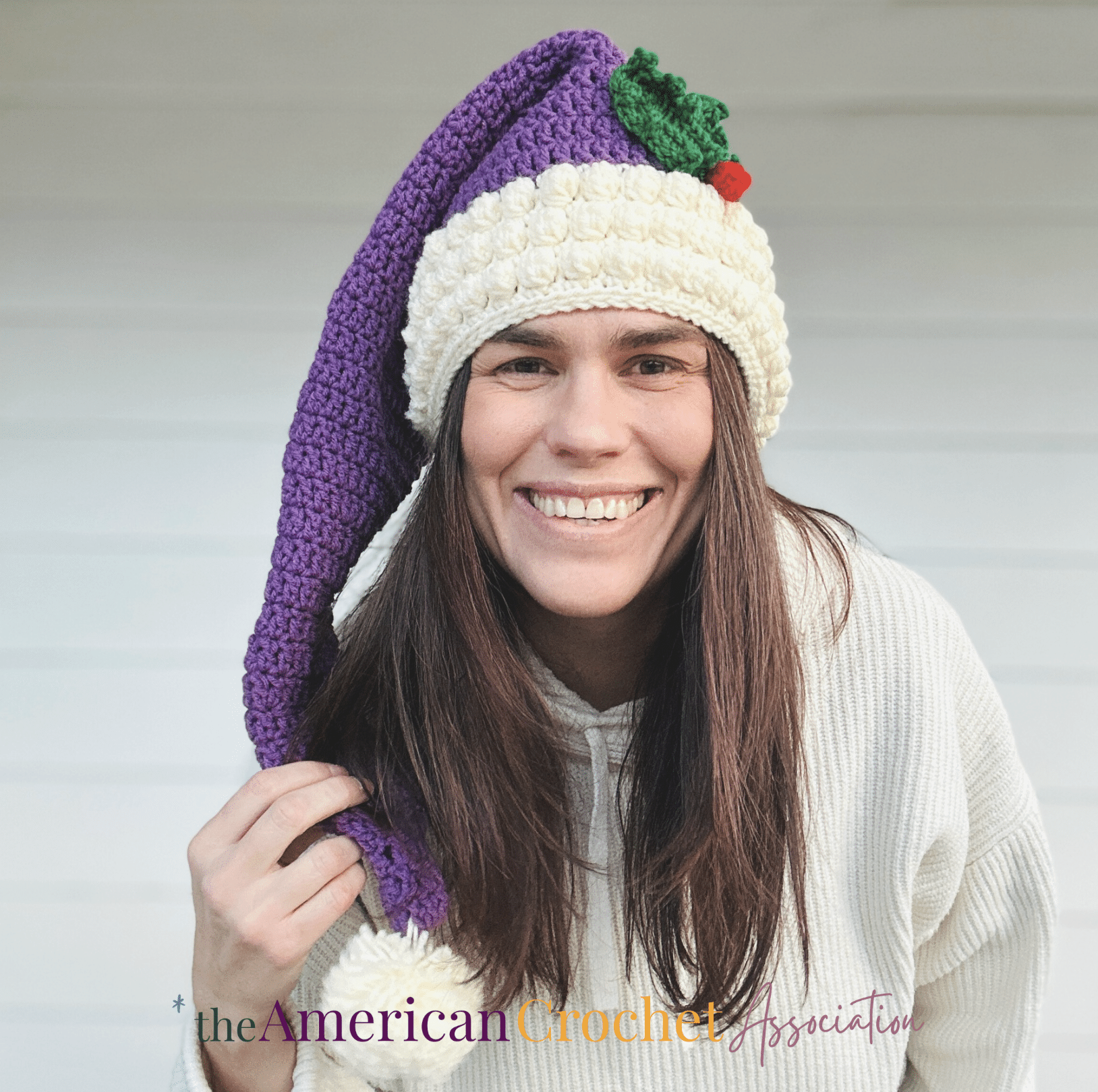 Woman wearing a long tail santa hat crochet pattern